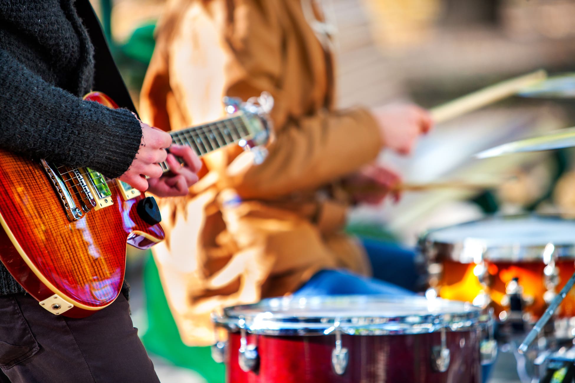playing guitar in a band