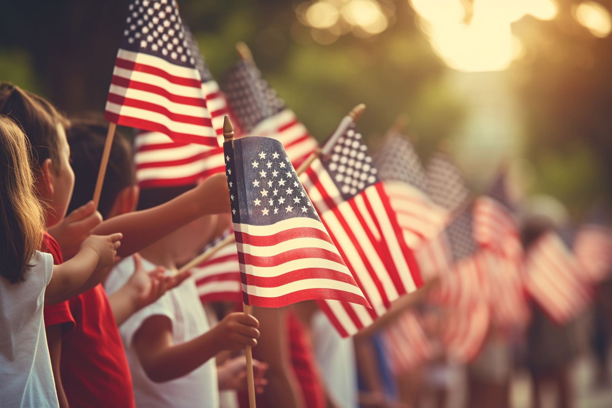 Children waving American flags in a parade