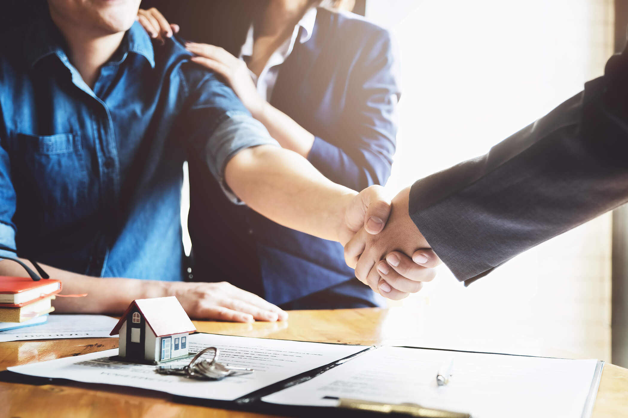 Handshake making a deal to sell your home