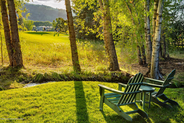 A view of backyard at 805 Cemetery Lane, Aspen, CO home for sale, overlooking Aspen Golf Course