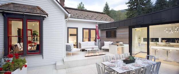 The two-level outdoor back deck with lounge area and outdoor dining room at 114 Neale Avenue, Aspen, Colorado, listed for sale by Coldwell Banker Mason Morse.