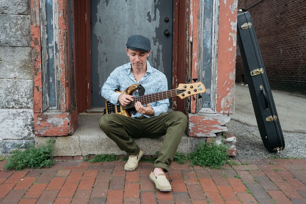 John Ferrara (Of Consider the Source) Solo Bass Performance Logo