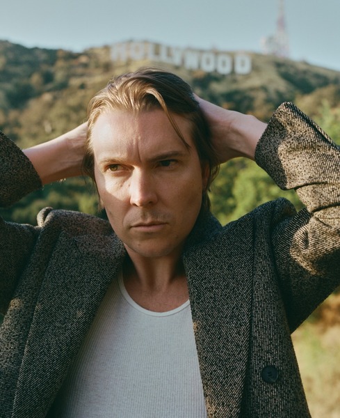 Alex Cameron, with Josh da Costa Logo