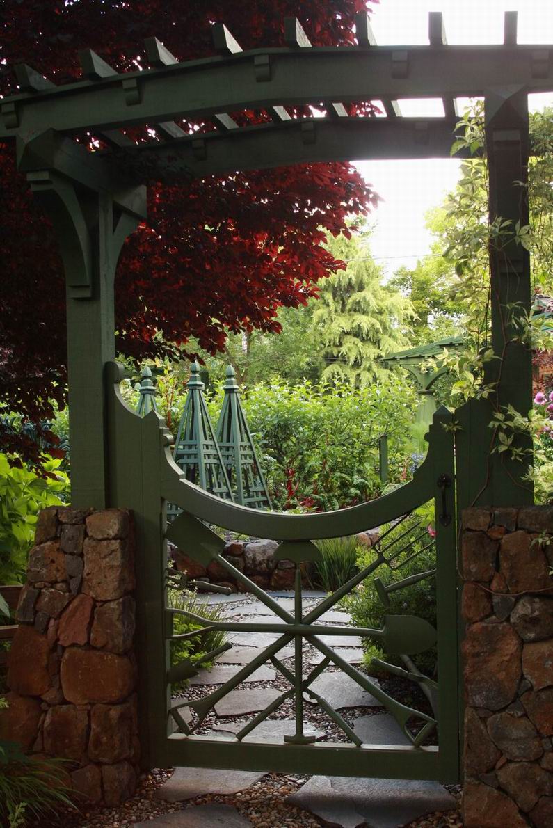 A garden gate fit for a....gardener! FineGardening