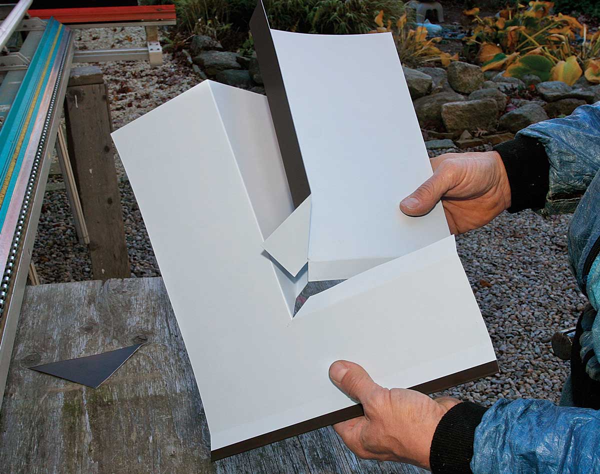 Interlock the two pieces. Assemble the pieces so that the front’s tab goes under the side piece and the front’s bottom flange sits on top.