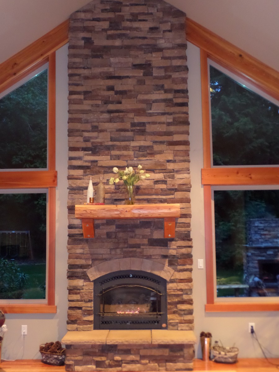 Great Room and Outdoor Fireplace in the Distance Fine Homebuilding