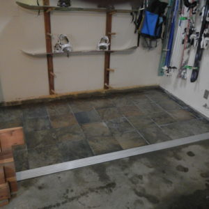 How to tile a portion of a concrete floor and create a safe transition