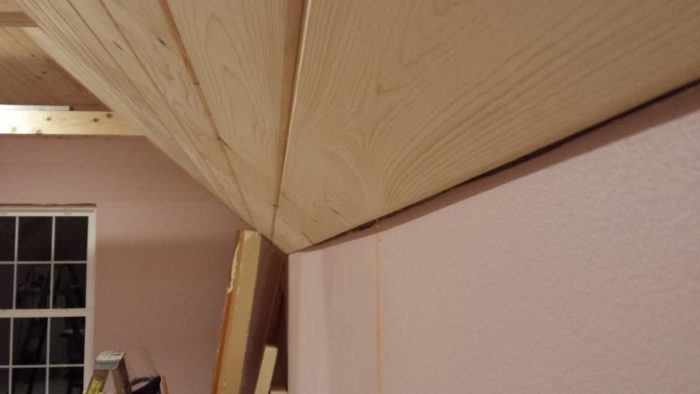 Trimming varying gap between drywall and tongue & groove pine ceiling