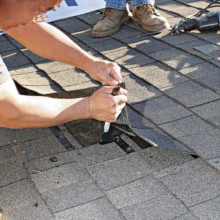 1  Lift up on the shingle to remove the roofing nails.