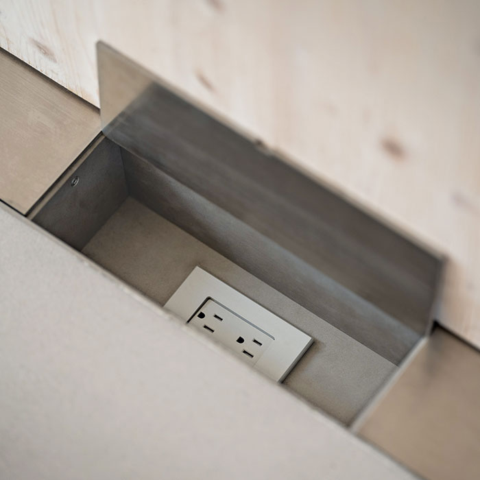 close up of electrical chase in the floor