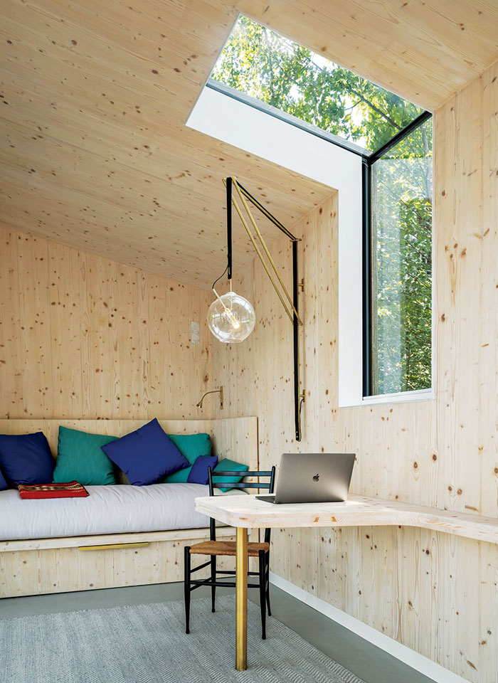 A skylight reaches up the wall and wraps into the ceiling