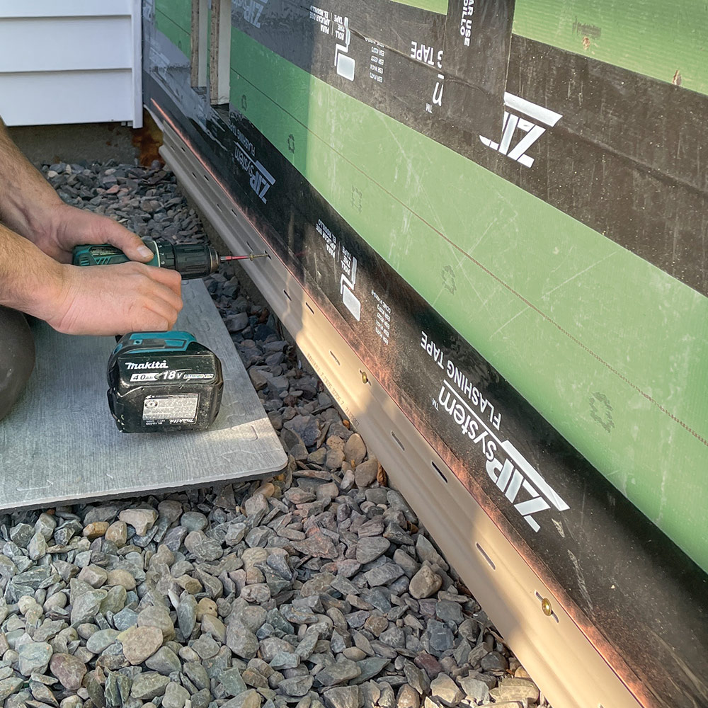 beginning a vinyl-siding installation with the starter strip
