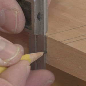 A Moxon vise mounted on a workbench, demonstrating its vertical clamping action and compact design.