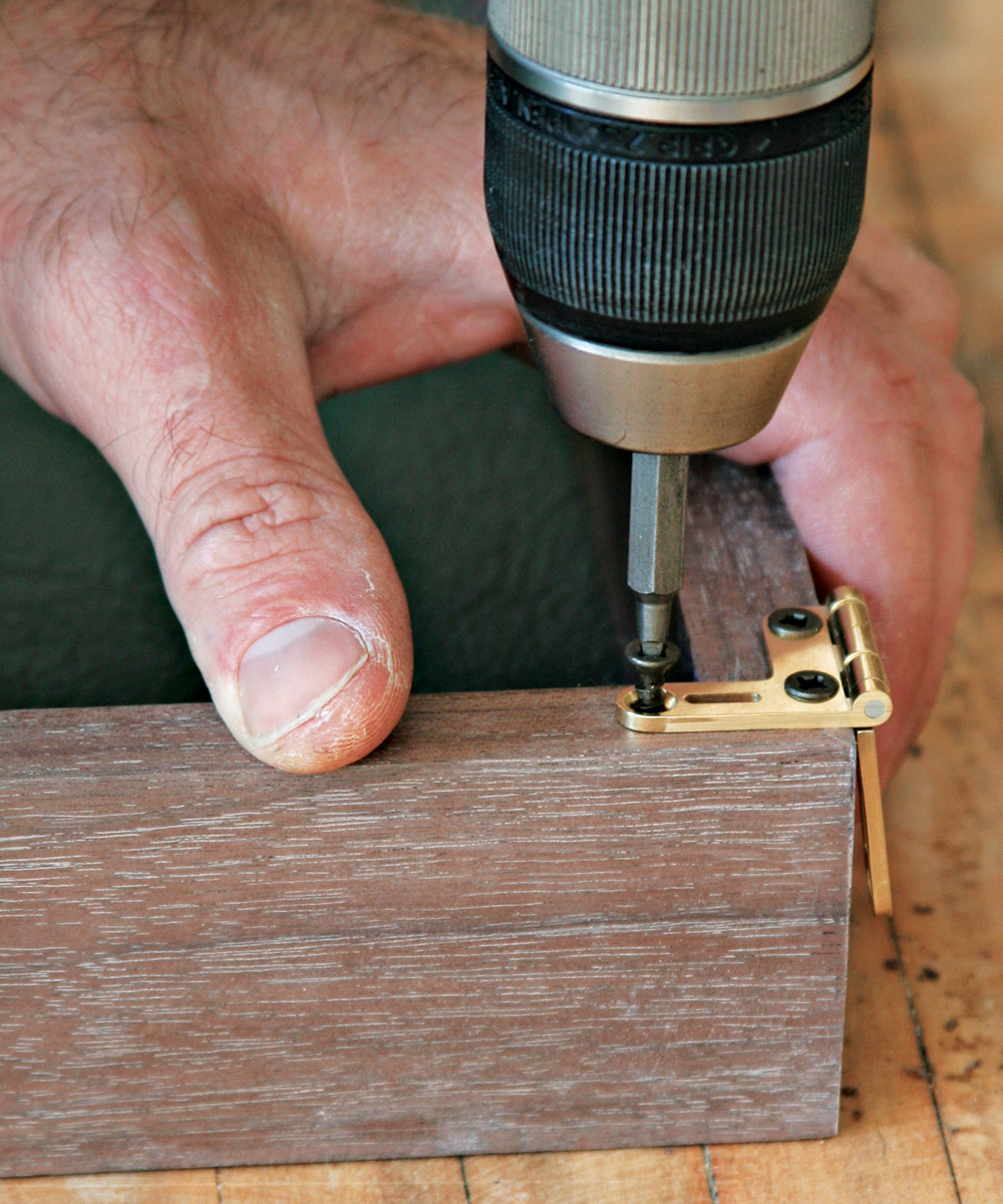 Attach the hinge with steel screws