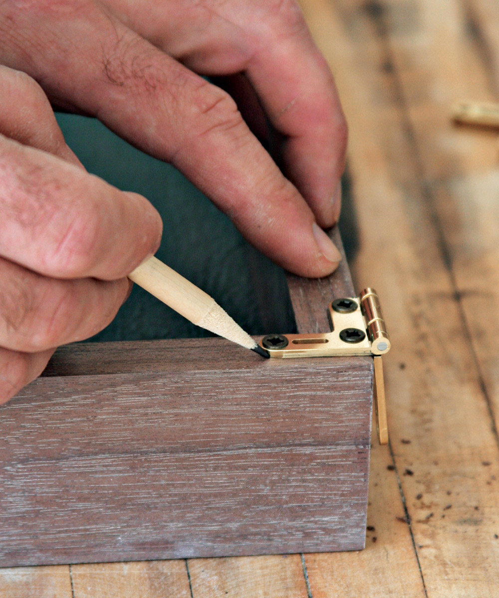 Outline the hinge with a sharp pencil