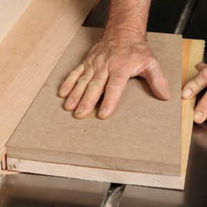Push the assembly through the saw with the pattern on top, riding against the L-fence. You can cut all four sides.