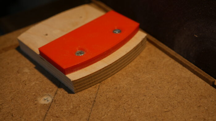 A curved template for a disc sander. The fence has been created by a 3D printer.