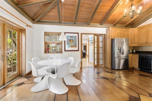 Small kitchen off to the side of guest quarters and door leading to third smaller living room