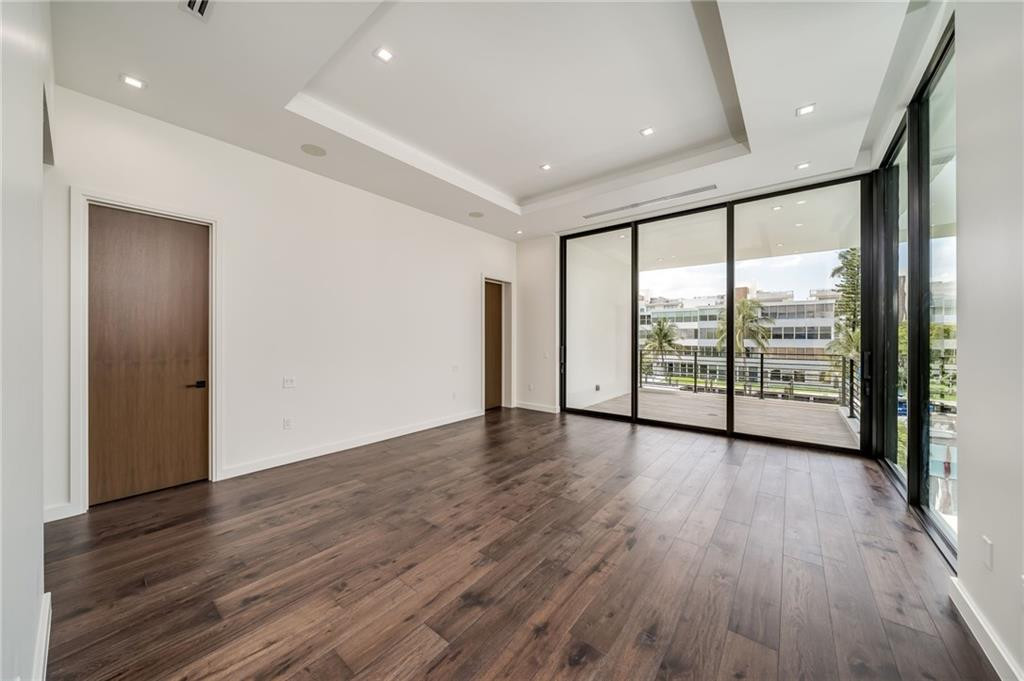 Both wooden doors lead to individual walk-in closets.
