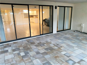 Photo for 1376 The 12th Fairway, Wellington, FL 33414 - listing #FX-10305094 Living room sliders open to covered patio