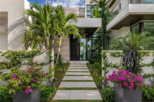 Welcoming Courtyard Entry with Lush Gardens greeting you