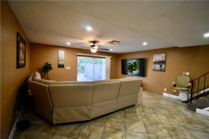Photo for 3185 Coral Springs Drive, 127, Coral Springs, FL 33065 - Listing #FX-10310779 Living room with sliders to the screened patio