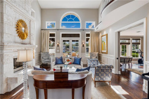 Living / Fireplace with Pool and Water Views