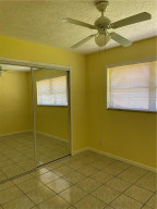 Photo for 10760 NW 43rd Court, Coral Springs, FL 33065 - Listing #FX-10313517 Bedroom 3 with Walk-in Closet With Mirror Front