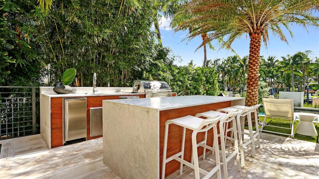 Full outdoor kitchen and grill.