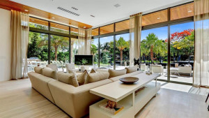 Casual living area looking out over patio oasis.