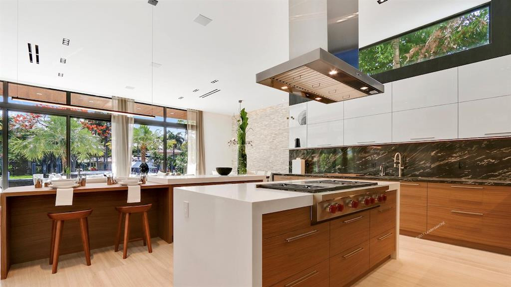 Generous kitchen island with Wolf gas stove.