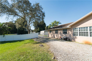 Photo for 5621 SW 163rd Avenue, Southwest Ranches, FL 33331 - Listing #FX-10314352 South Side of home with built up pad to drive on that goes beyond the fence line into the backyard - Great for RV parking, boats, etc.