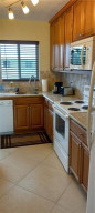 Lovely, updated kitchen with wood cabinetry, granite countertops and like new appliances Lovely, updated kitchen with wood cabinetry, granite countertops and like new appliances