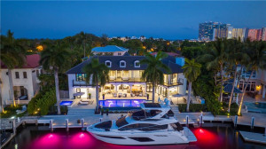 Backyard shot at night with dock lights on.