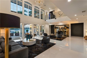 Main living area with access to backyard through multiple doors.