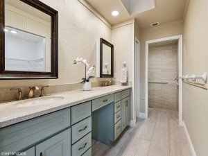 Finely appointed primary bath is pristine clean with extra storage spaces.