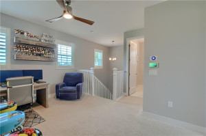 Loft toward stairs. Doorway to right is laundry