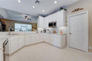 Wide-open UPDATED kitchen features quartz counters.