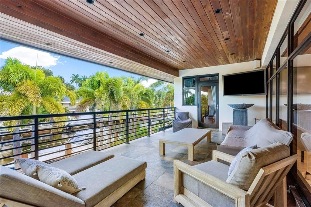 BALCONY OVERLOOKING POOL & WATERWAY
