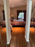 Walk In Closets on both sides of hallway from Master Bedroom to Master Bathroom