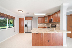 Updated Kitchen With Granite Counters, Wood Cabinets, & Stainless Steel Appliances Updated Kitchen With Granite Counters, Wood Cabinets, & Stainless Steel Appliances