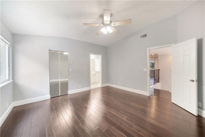 Stairwell With Updated Wrought Iron Stairs & Wood Floors Leading To Bedrooms Stairwell With Updated Wrought Iron Stairs & Wood Floors Leading To Bedrooms