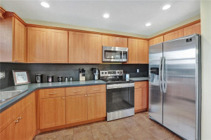 Photo for 10630 NW 16th Street, Coral Springs, FL 33071 - Listing #FX-10355959 ANOTHER VIEW OF THE KITCHEN AREA WITH NEWER STAINLESS STEEL REFRIGERATOR FROM 2019