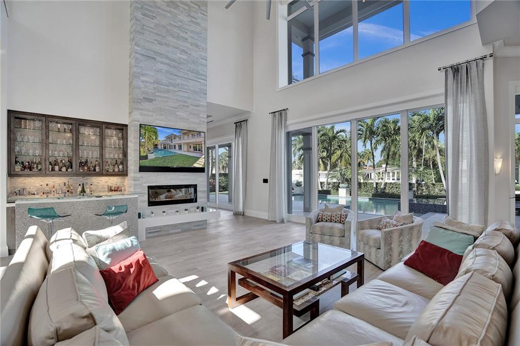 Decorative Fireplace, Floor to Ceiling Impact Glass Sliding Doors which Pocket Into Each Other