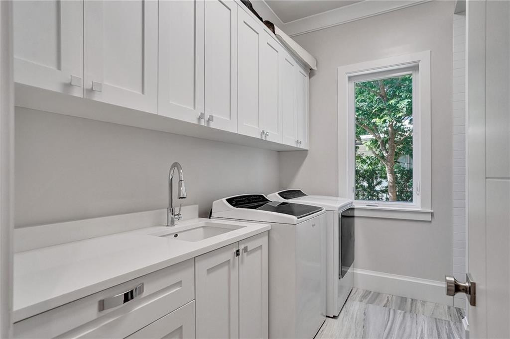 Downstairs laundry room with pet wash
