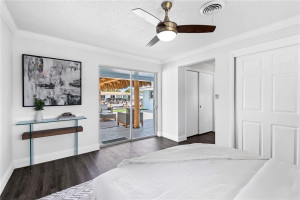 Primary bedroom with view to outdoor oasis