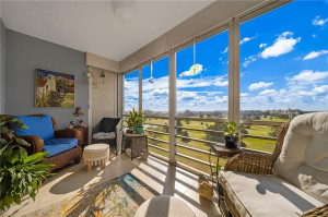 Completely updated top floor unit with sweeping south west views of the palm aire gold courses, screened in patio with pull down shutters