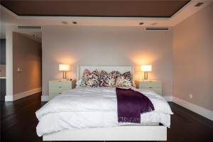 Large bedroom with canal views and covered balcony