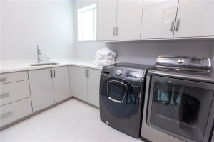 Spacious upstairs laundry. Additional W/D in garage