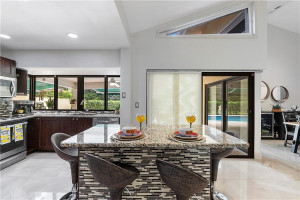 Enjoy morning coffee art the 5' island with accent wall.